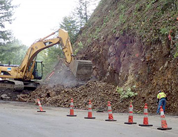 Excavating rock face on S curves north of Skyline Blvd, 9-19-2019