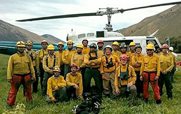 Shae Galloway and the Tom Fery fire crew. He is sixth from right, standing behind crew boss Glenn Segal (white helmet).