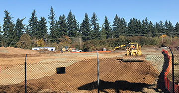 The parking lot adjacent to the Sunset Transit Center is under construction. Peterkort Company said they don’t know when it will be open. 