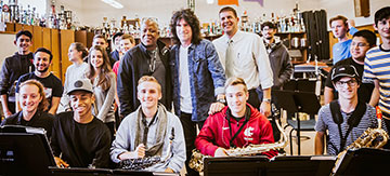 Greg Hall (SHS band director), Tommy  ayer, and John Huelskamp (SHS Principal) with Sunset music students