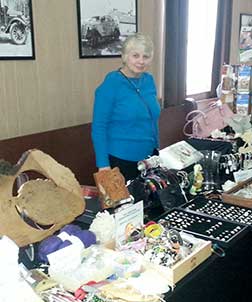 A vendor with her table at the Leedy Artisan Market.