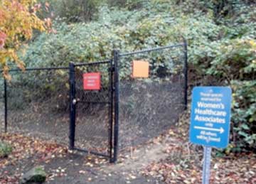 Fence blocking access to transit and hospital.