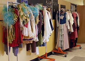 The costume room is a hive of activity in a basement room under the stage