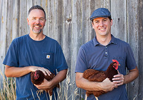 John and Geoff with two of their feathered friends. We don't know if either one is named Colin.