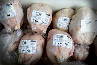 Chilled chickens ready for pickup are
shrink-wrapped and labeled.