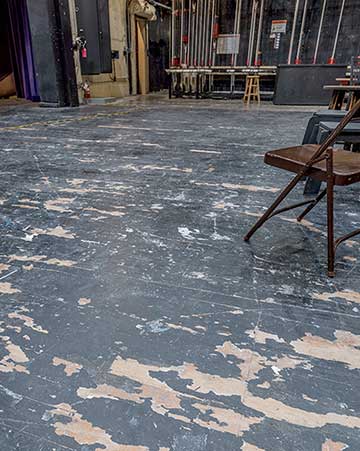 The worn theatre floor.