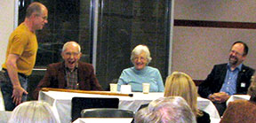Bruce gets a laugh from John and his wife Ada during John's retirement party at the county building