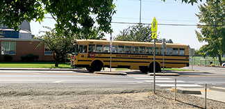 Sunset crossing with school bus