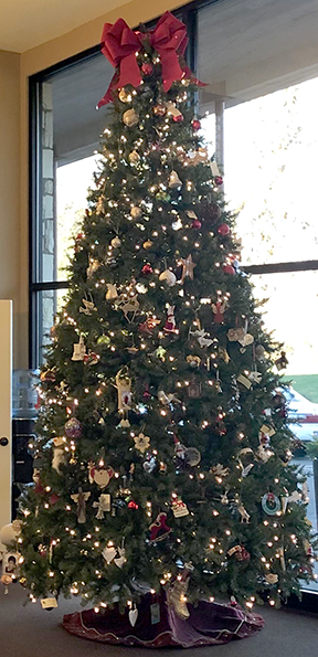 Skyline Memorial Gardens decorated holiday tree with bow on top