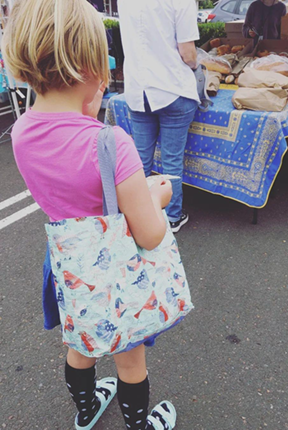 kid shopping at farmers market