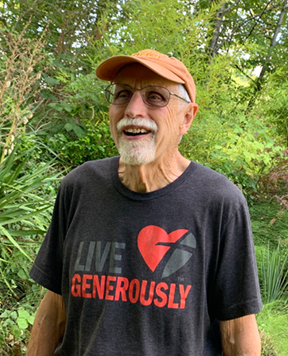 man in baseball cap in forest