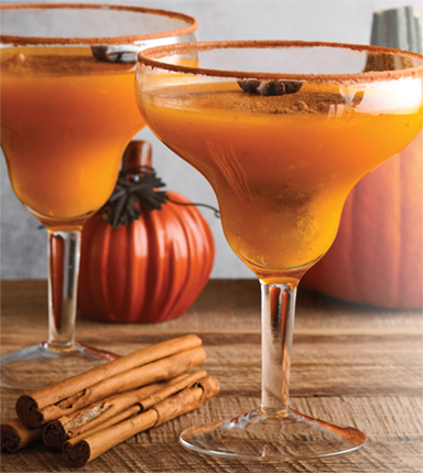 orange drinks against fall backdrop