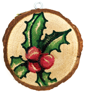 wood cookie ornament with holly painted on it
