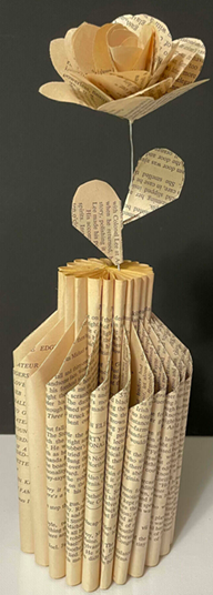 rose in vase made out of book pages