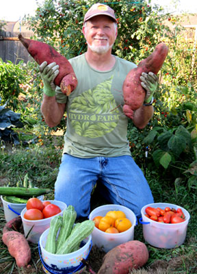darren morgan in the garden holding produce