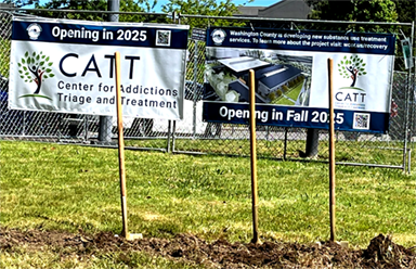 catt center banner with groundbreaking shovels in foreground