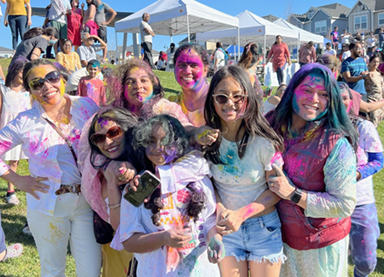 holi celebrants covered in bright colors