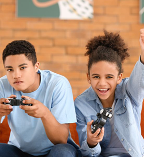 two teens holding gaming controllers